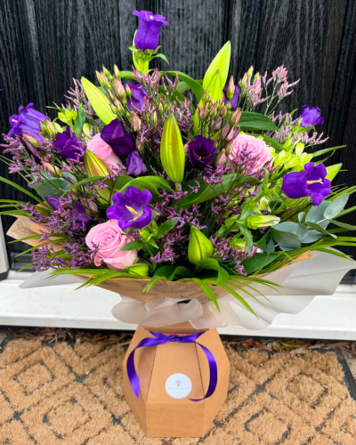 Cool Breeze - This classical stylish collection of flowers, make this hand tied the perfect gift. Flowers professionally arranged and delivered by a local florist.