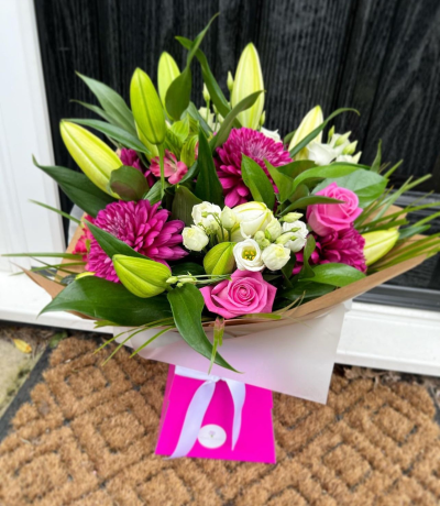 Ashleigh - A budding delight, complimented by greenery and presented in a gift box/bag. Beautiful flower bouquet hand delivered by the local florist.