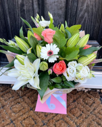 Evelyn - A fabulous collection of white and cream flowers make this the perfect gift. This bouquet will be hand delivered by the local florist.