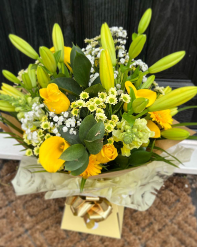 Sunrise - Energise their day with a stunning surprise. A warm collection of seasonal flowers artistically arranged by an artistic florist.