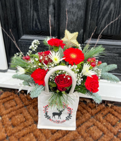 Radiant Reindeer Jute - A selection of customer favourite flowers and foliage in a design that's simply the perfect Christmas present.